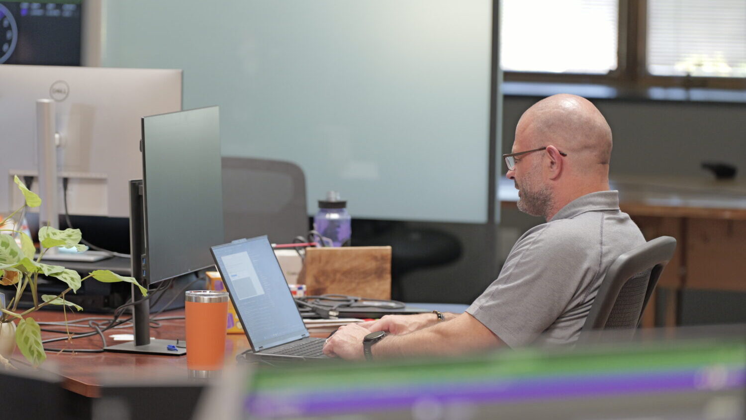 IntelliTect software engineer working on a laptop